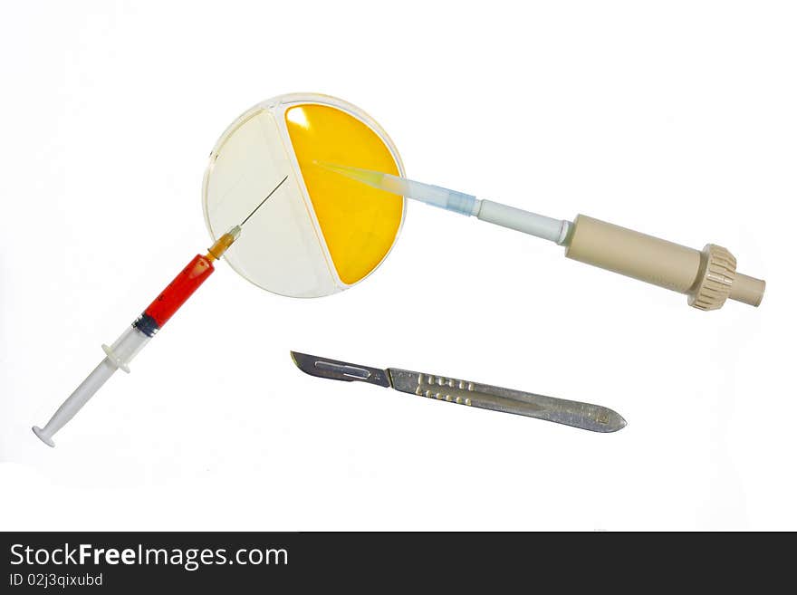 Petri dish with media culture pipette syringe and scalpel useful for medical and cancer research isolated on white background. Petri dish with media culture pipette syringe and scalpel useful for medical and cancer research isolated on white background