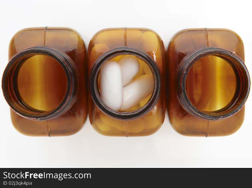 Overhead view of pill bottles on white background. Overhead view of pill bottles on white background