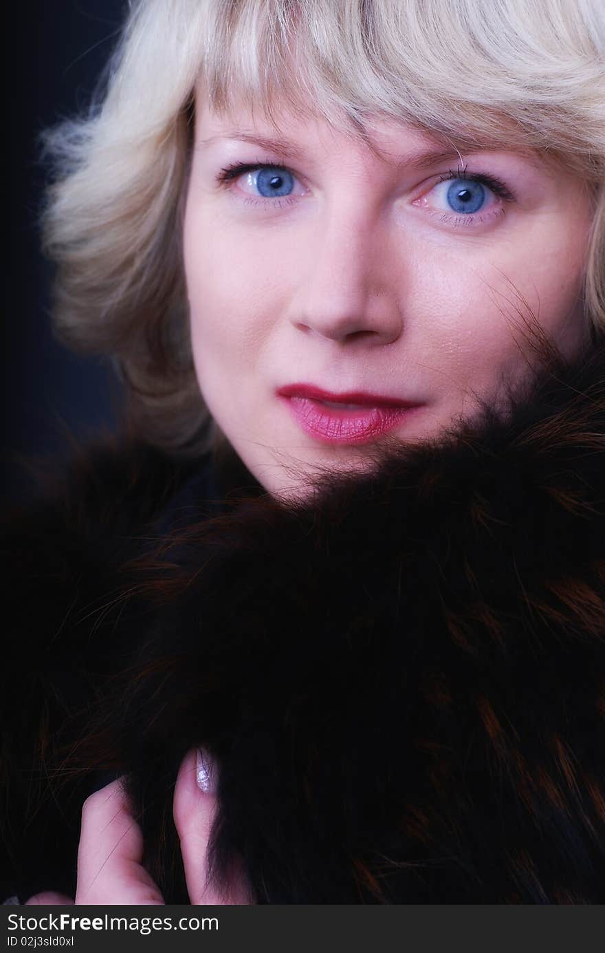 Glamour portrait of pretty woman wearing a fur coat. Glamour portrait of pretty woman wearing a fur coat