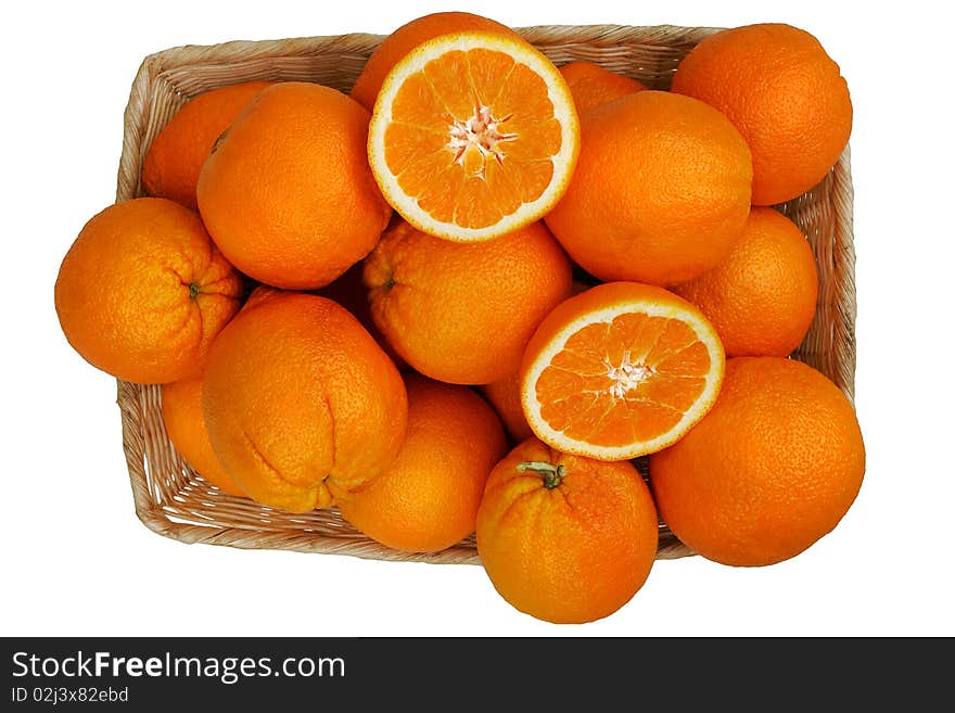 A basket of fresh organic oranges. A basket of fresh organic oranges