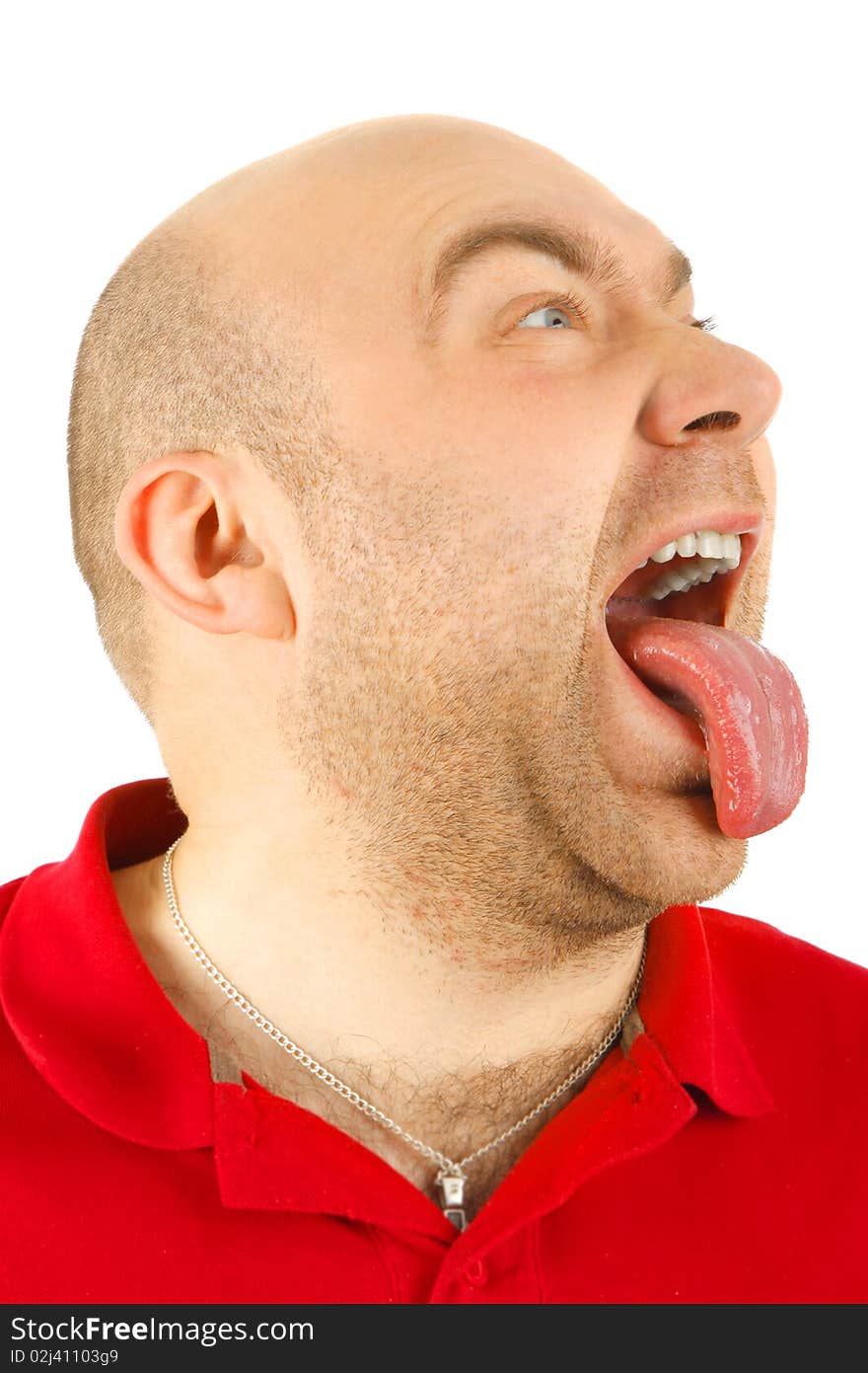 The man puts out the tongue on a white background. The man puts out the tongue on a white background