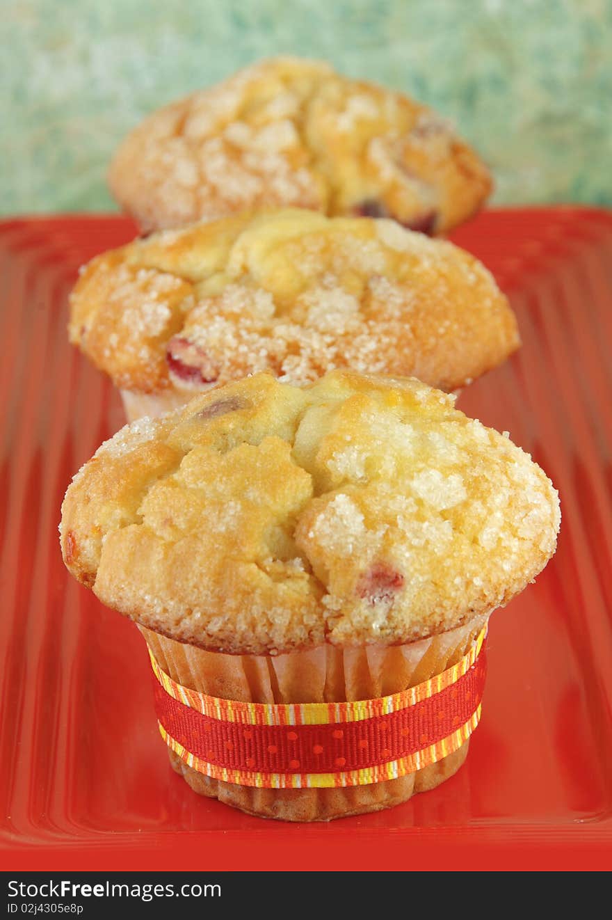 Three Muffins on Red Plate