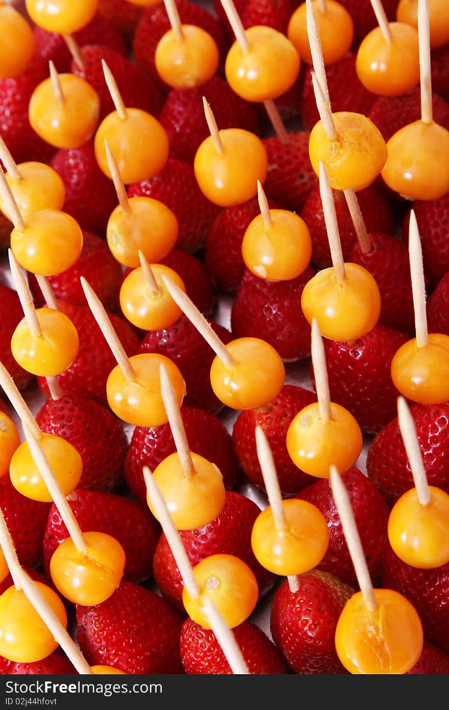 Fruits Background. Cape gooseberry and strawberries