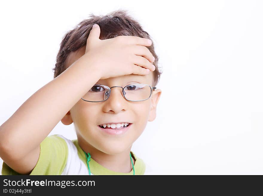 Tired child with glasses looking at the camera