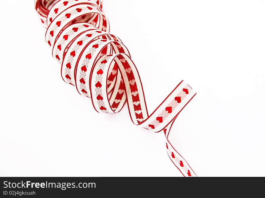 Ribbon with red hearts isolated on a white background