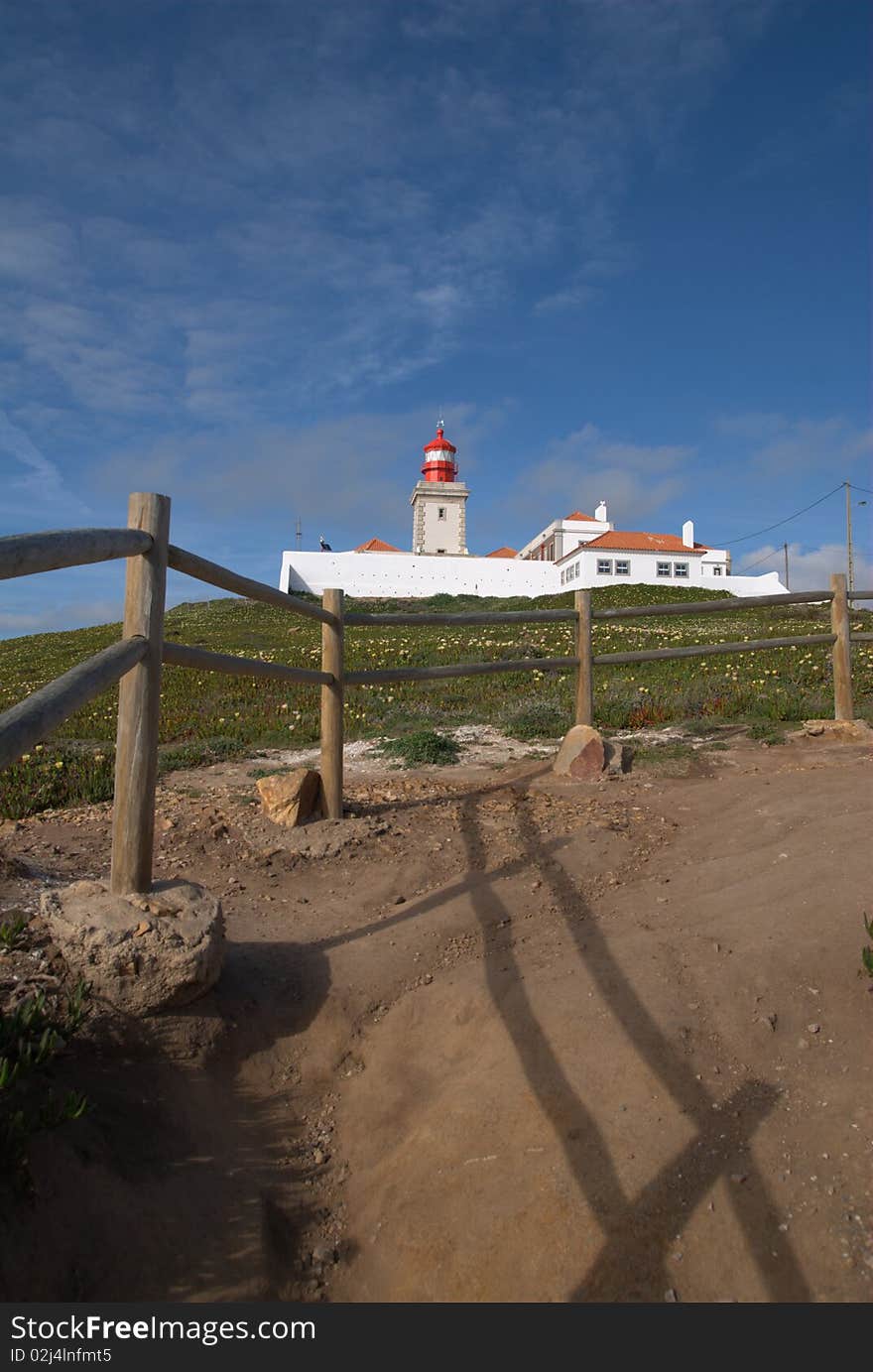 The path to a lighthouse on top of a hill