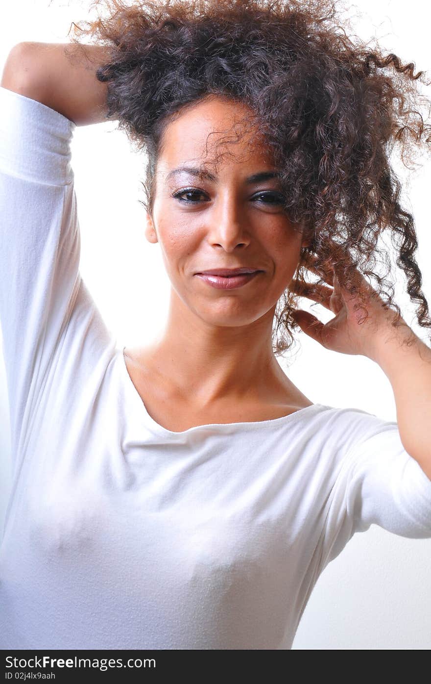 Portrait of beautiful woman holding her hairs.