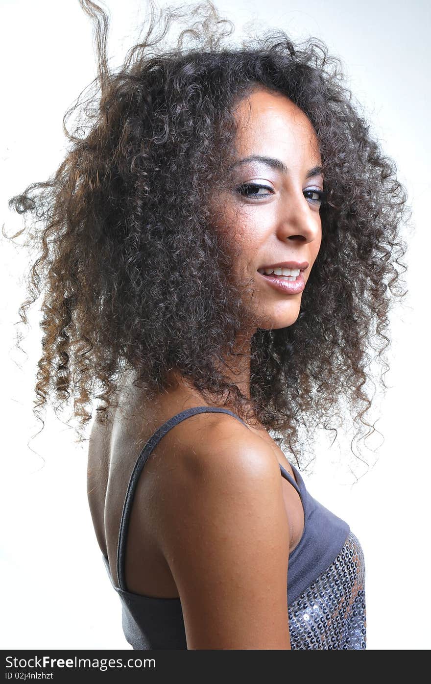 Portrait of beautiful woman with curly hairs.