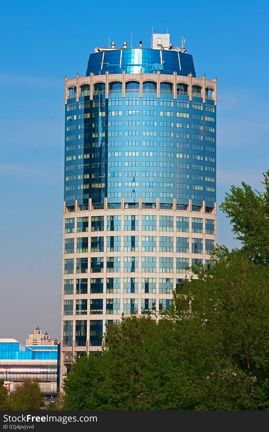 Modern business tower. Blue glass and concrete