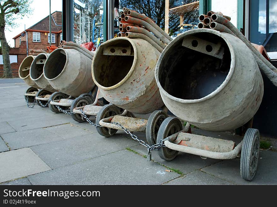 Row of concrete mixers on the pavement