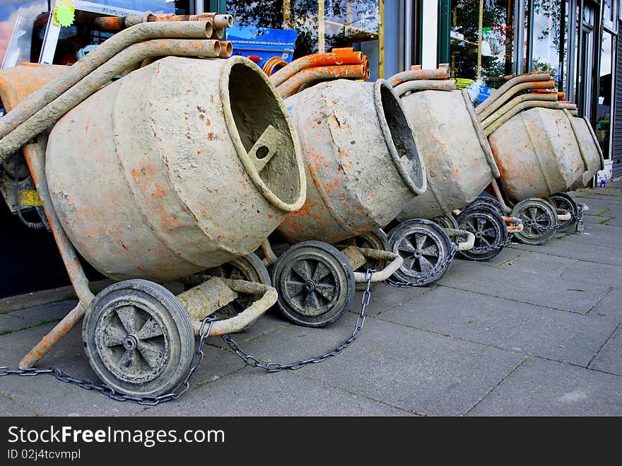 Row of concrete mixers on the pavement