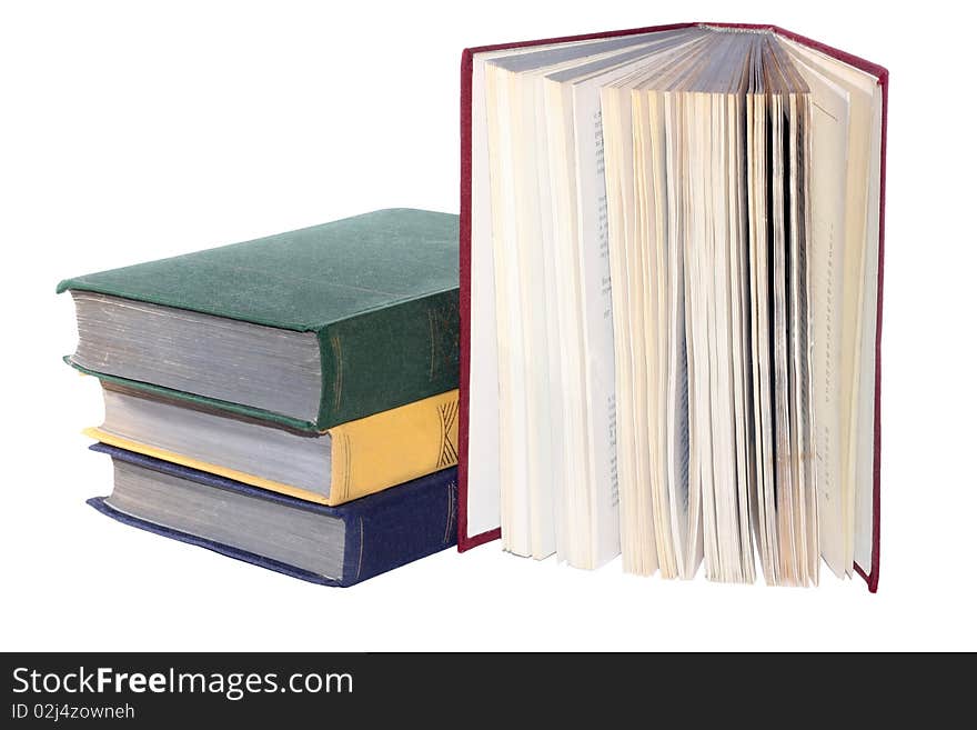 Some multi-coloured books on a white background