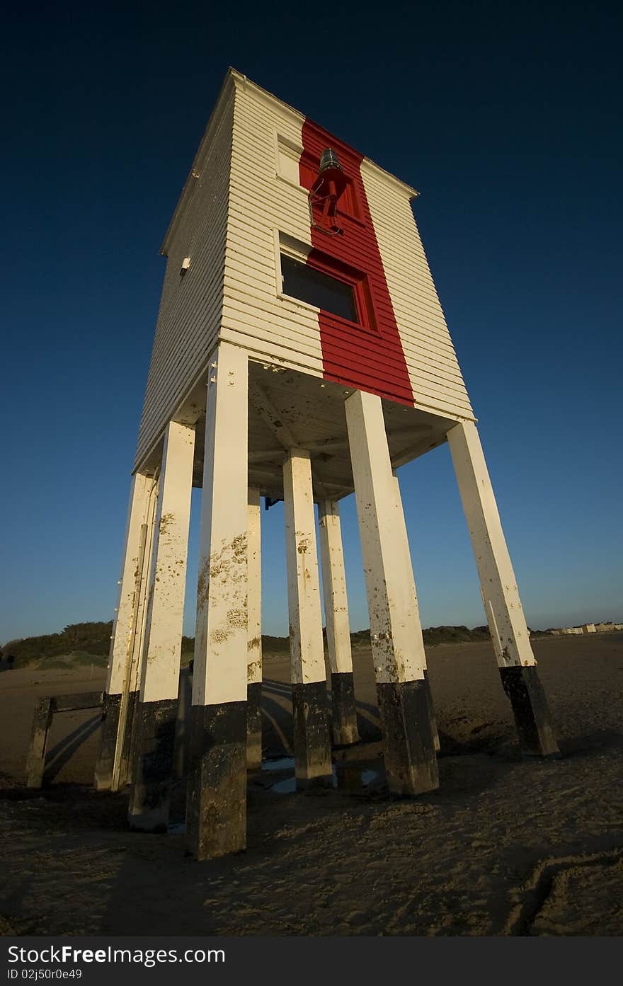 Beach scene with lighthouse