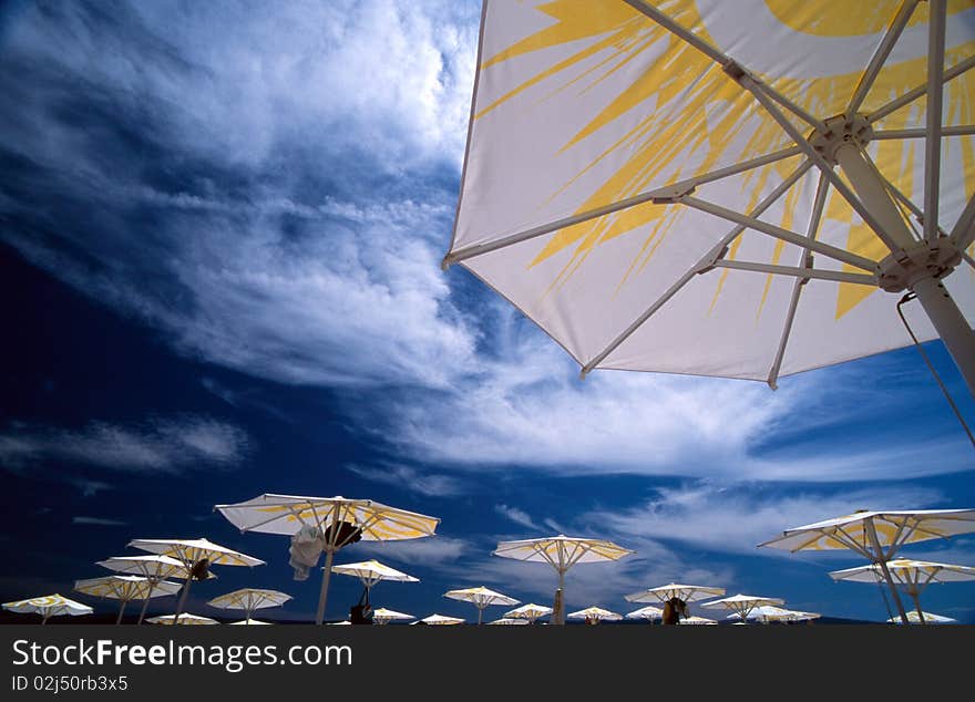 Parasols In Front Of Blue Sky