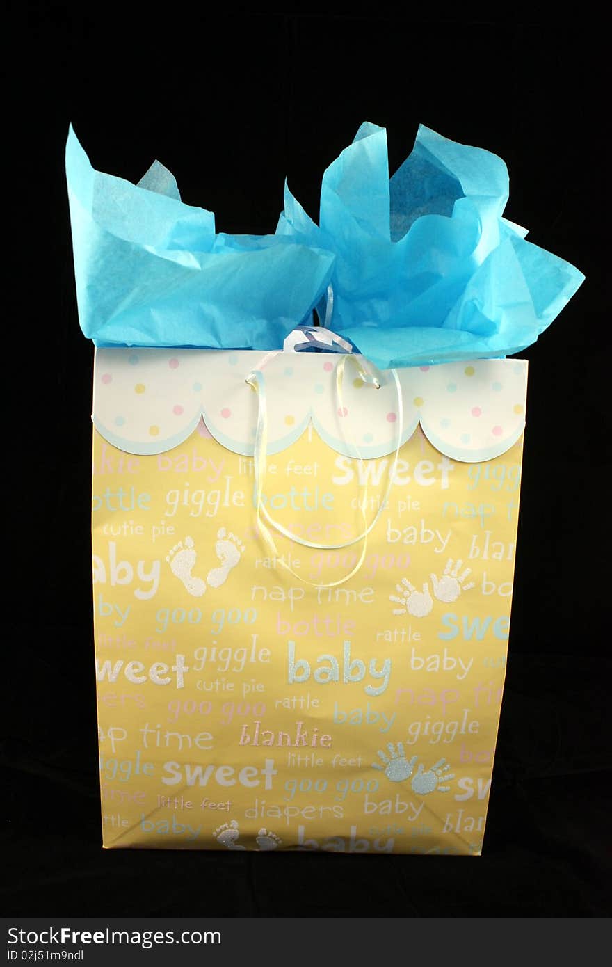 A gift box for a baby boy with black background. A gift box for a baby boy with black background