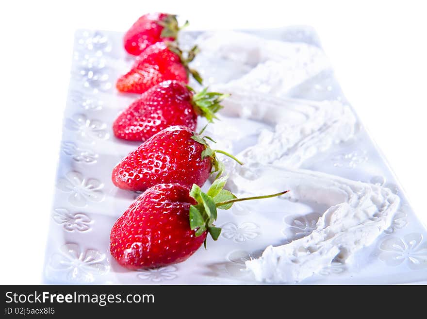 Delicious freshly strawberry with cream on plate