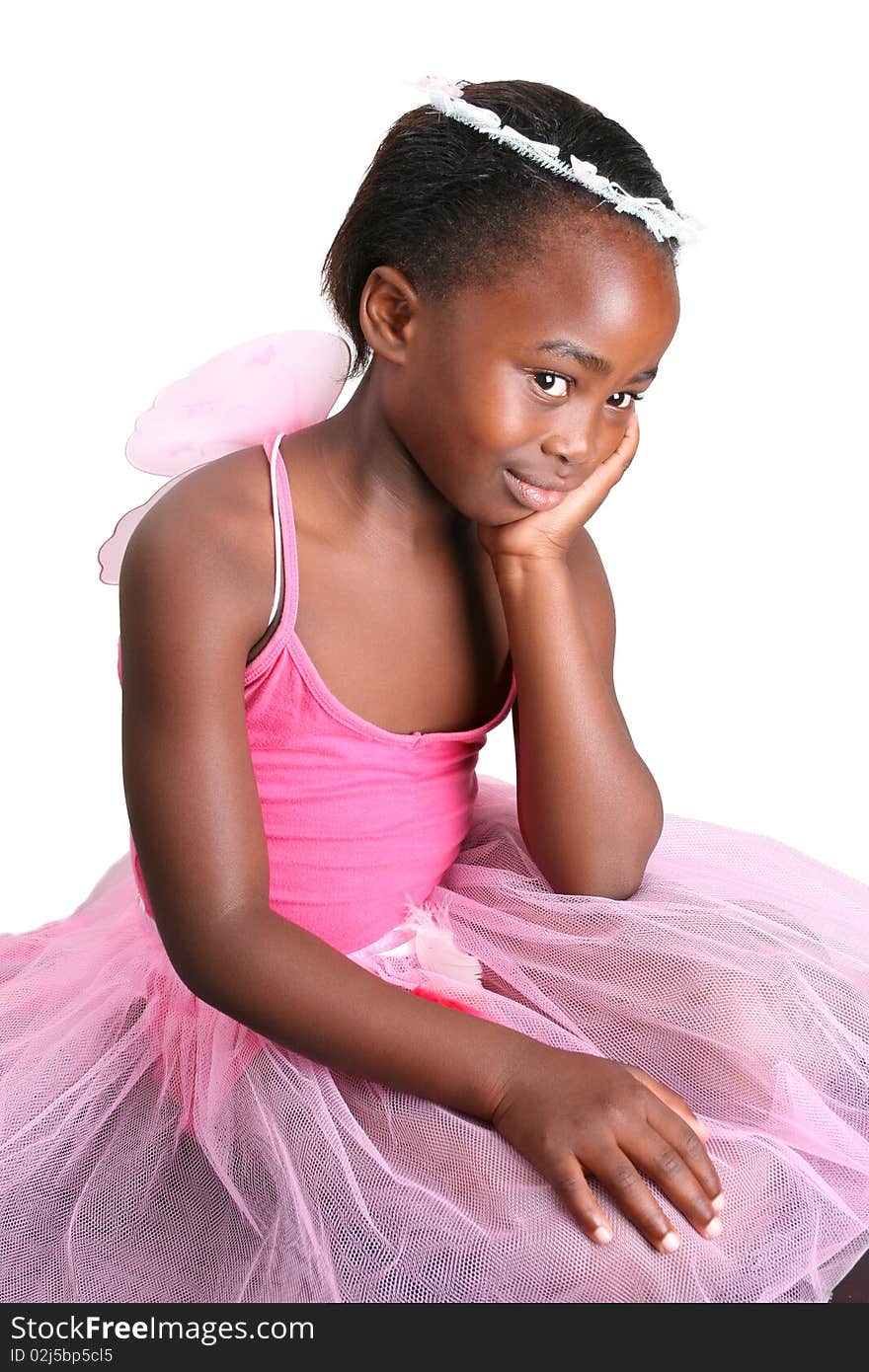 Young girl wearing a pink fairy costume with accessories. Young girl wearing a pink fairy costume with accessories