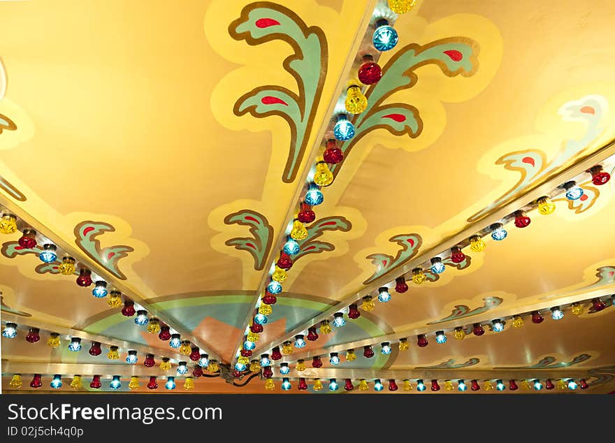 Colorful lights on carousel ceiling