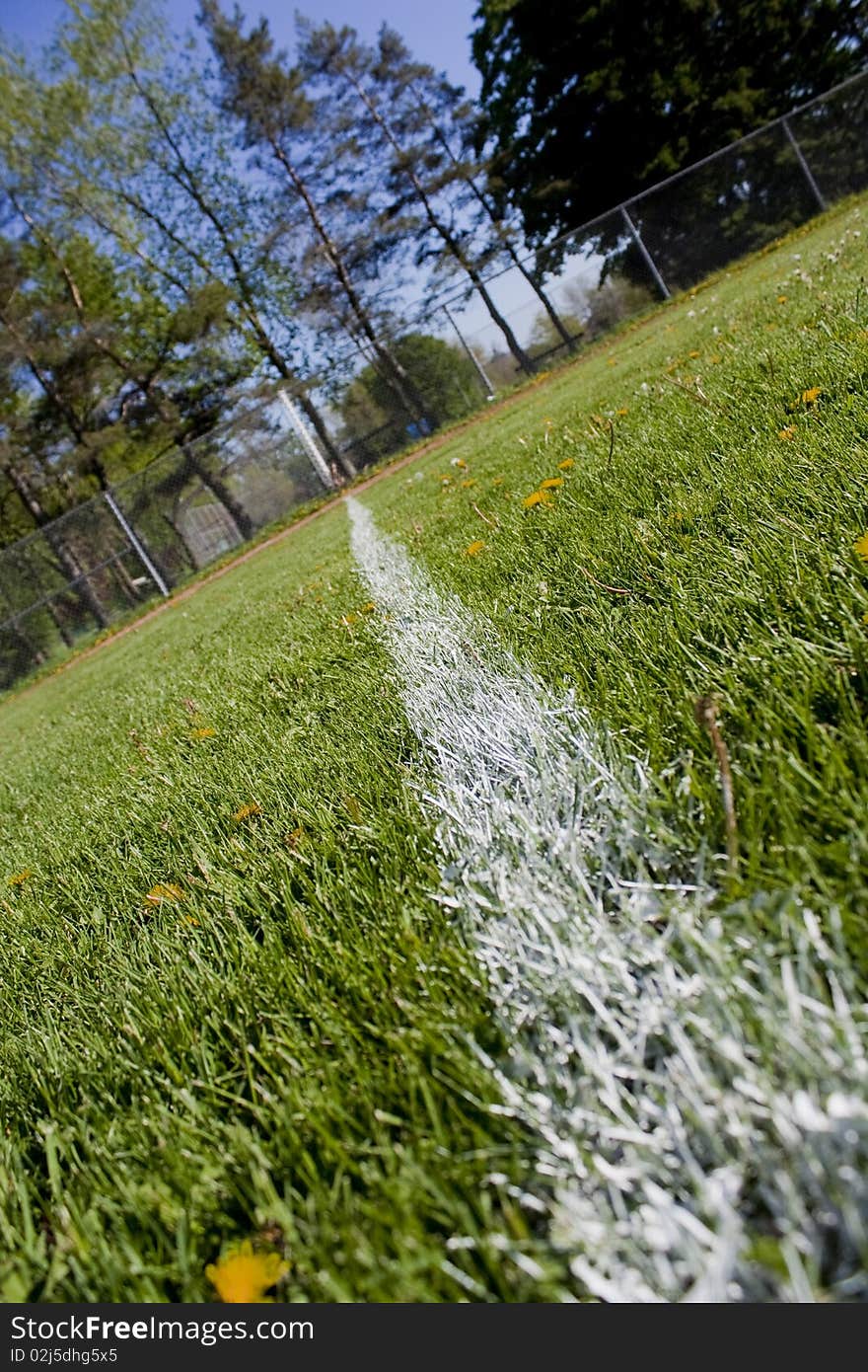 Foul line on a grass baseball field