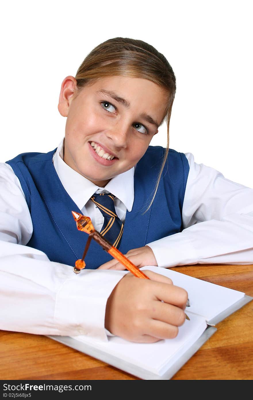 Teenage School girl busy with her homework, wearing uniform