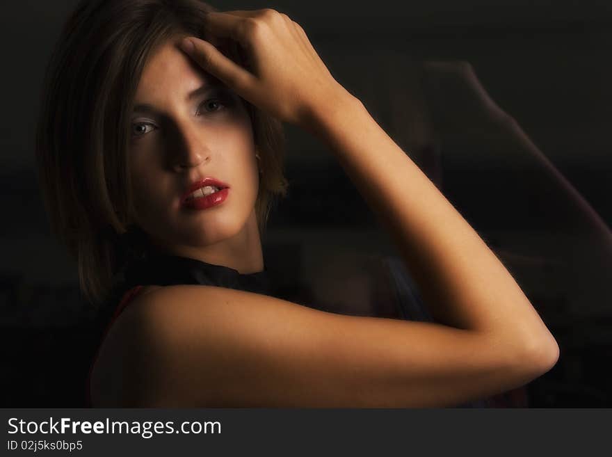 Young Adult Standing By The Window