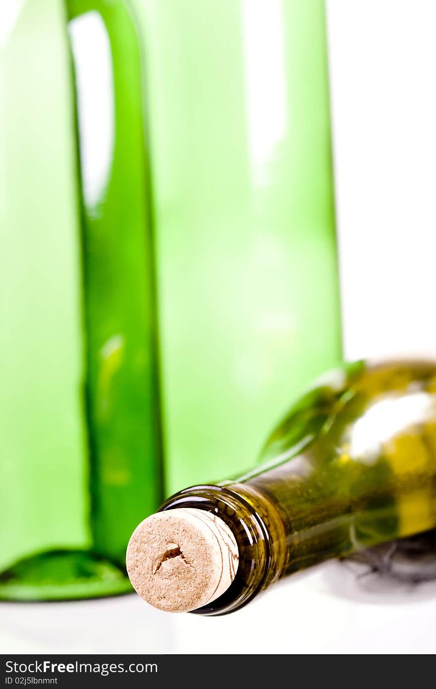 Green wine bottles on white background