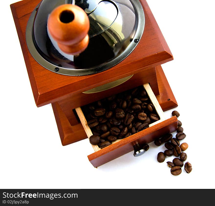 Coffee machine grinds the coffee on a white background. Coffee machine grinds the coffee on a white background