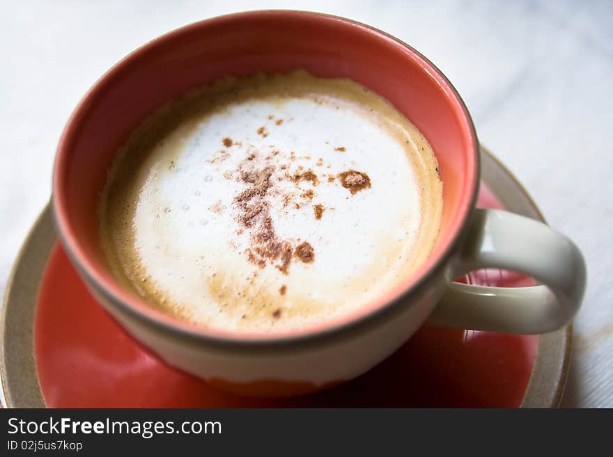 A cup of coffee on white background.