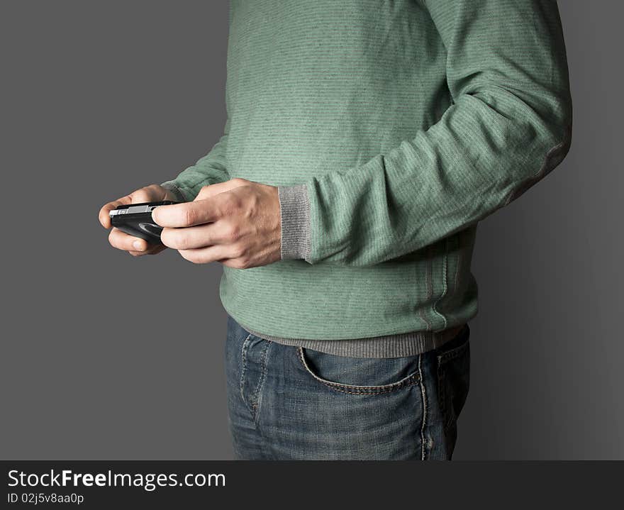 Men playing mobile videogame with grey background