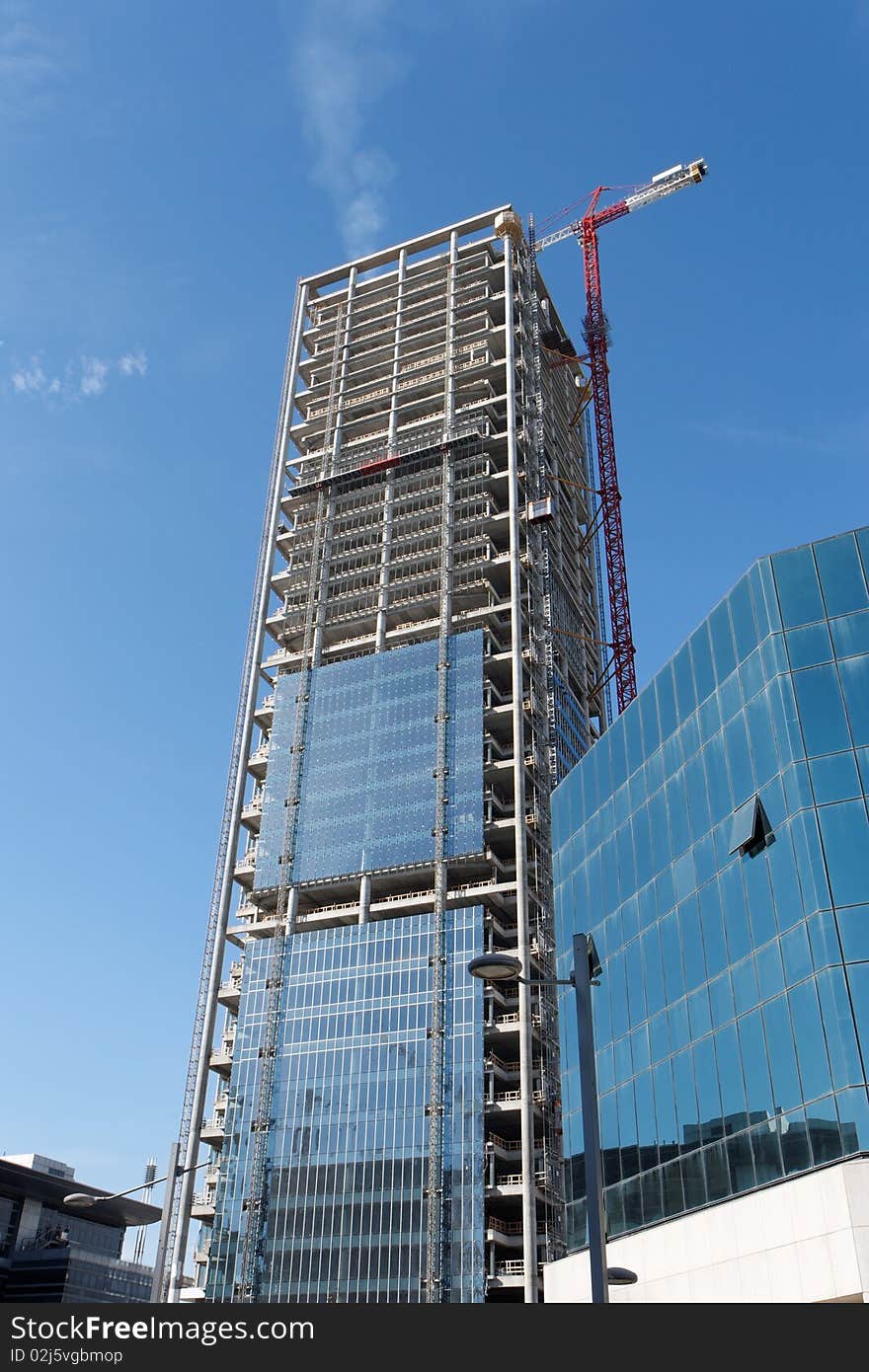 Lifting Crane At Skyscraper Construction