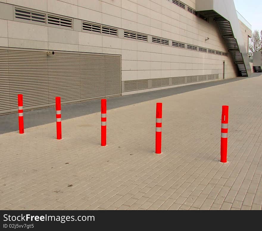 Red bollards on the street close road. Red bollards on the street close road