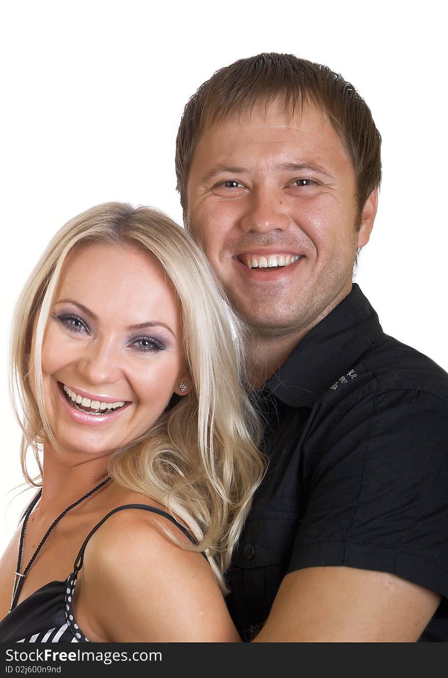 Happy young pair pose on a white background. Happy young pair pose on a white background