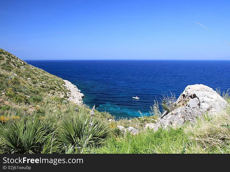 A glimpse of the rock and the blue sea in the natural reserve of Zingaro Sicily Italy. A glimpse of the rock and the blue sea in the natural reserve of Zingaro Sicily Italy