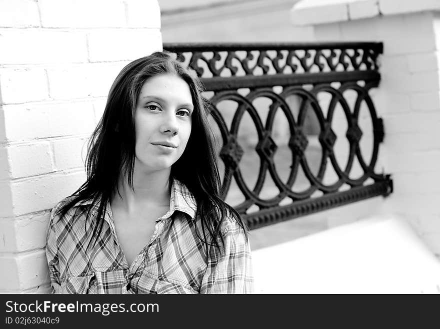 Girl near old iron fence. Girl near old iron fence