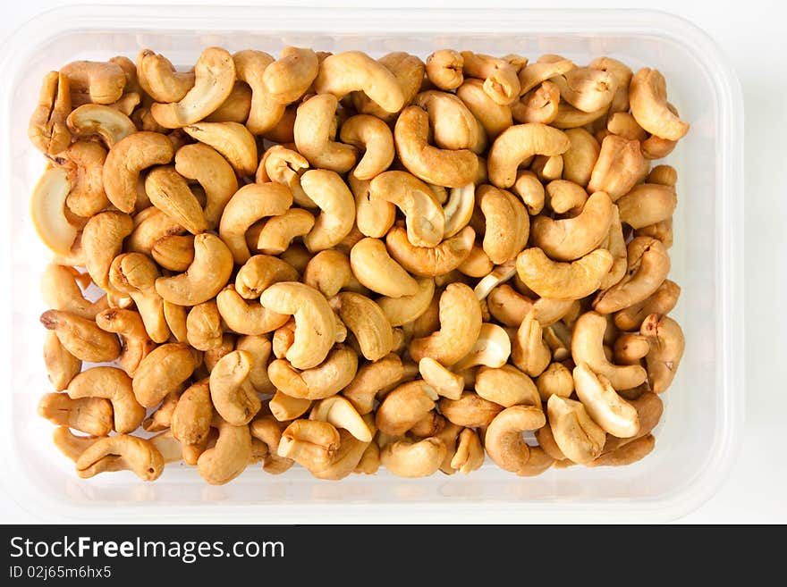 Much of nut in open box on white background