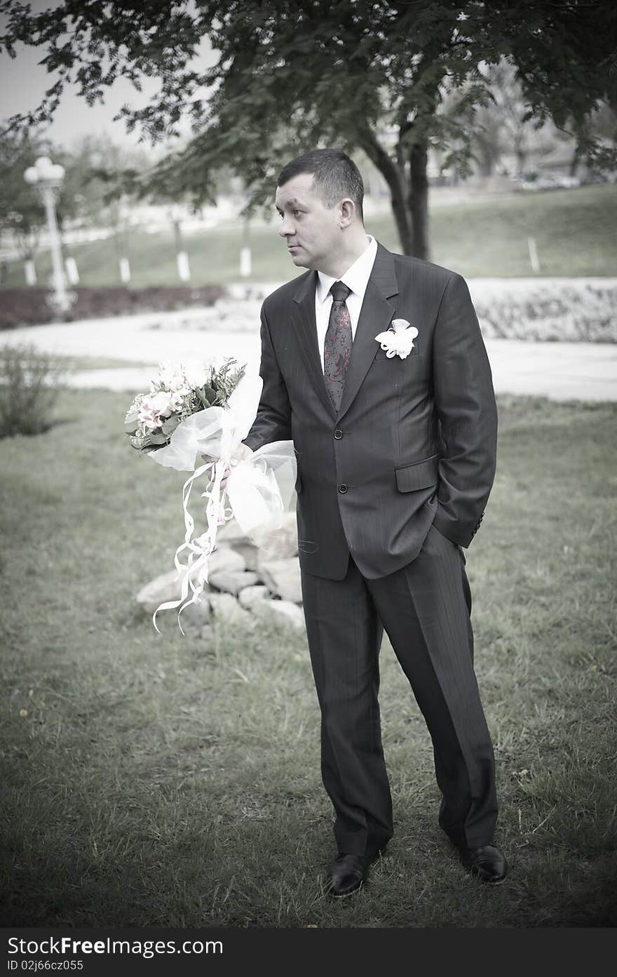 Husband with flowers in tuxedo