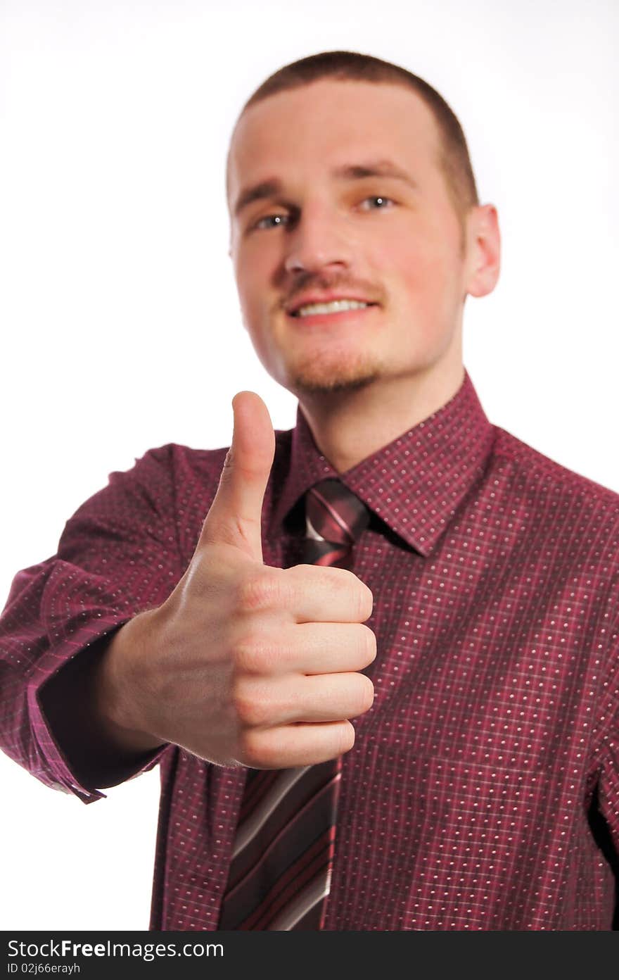 Young businessman showing thumb up. Young businessman showing thumb up