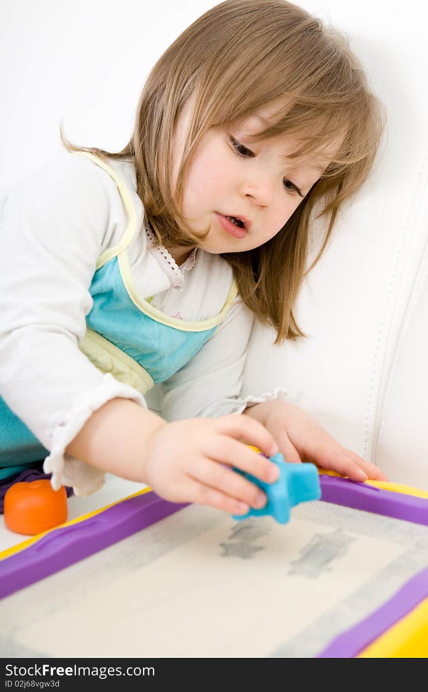 Sweet happy little girl drawing