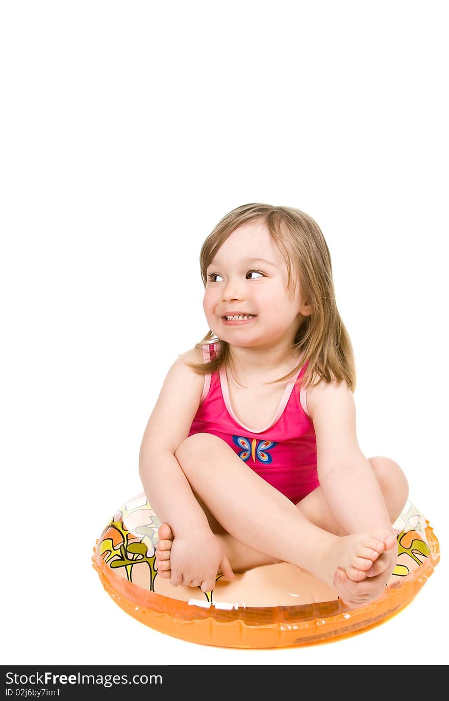 Sweet happy little girl on the beach isolated