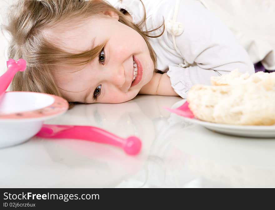 Sweet happy little girl eating