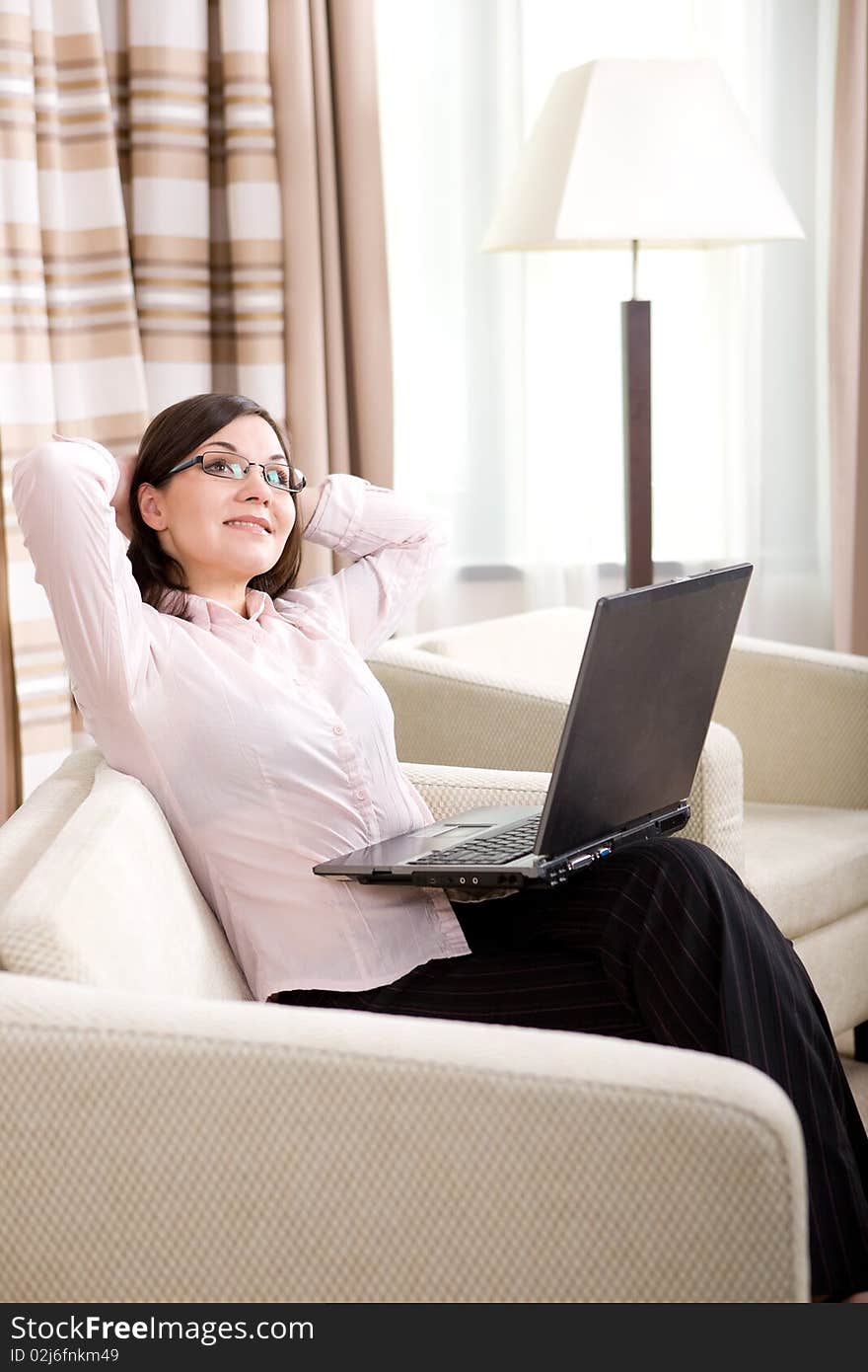 Young attractive business woman with laptop. Young attractive business woman with laptop