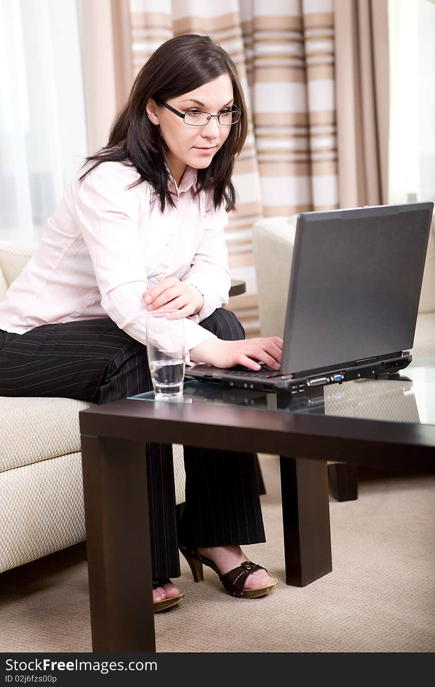 Young attractive business woman with laptop. Young attractive business woman with laptop