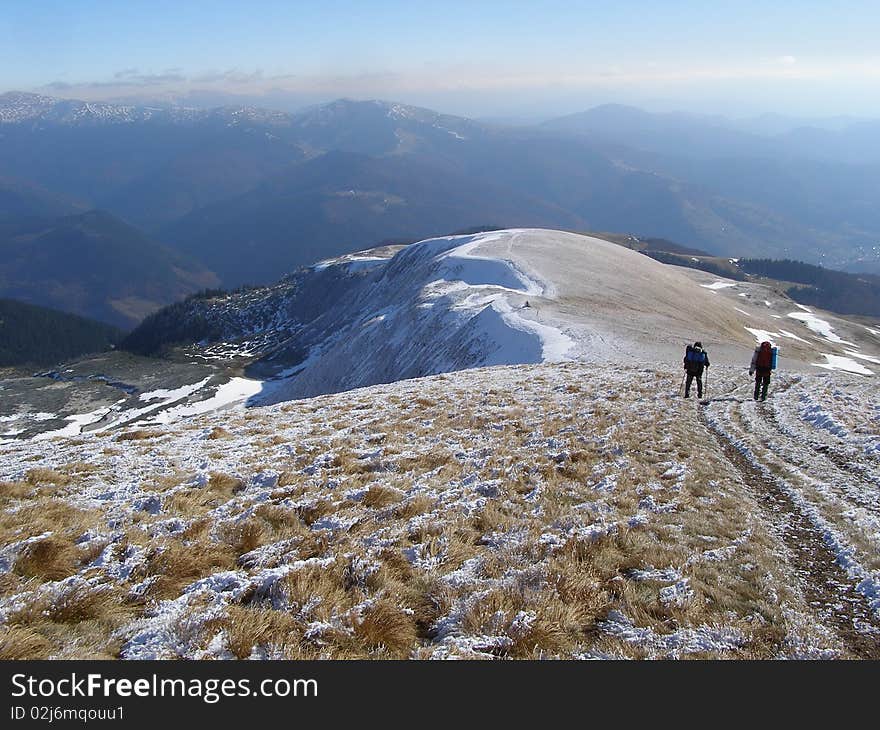 Tourists In A Mountain Landscape