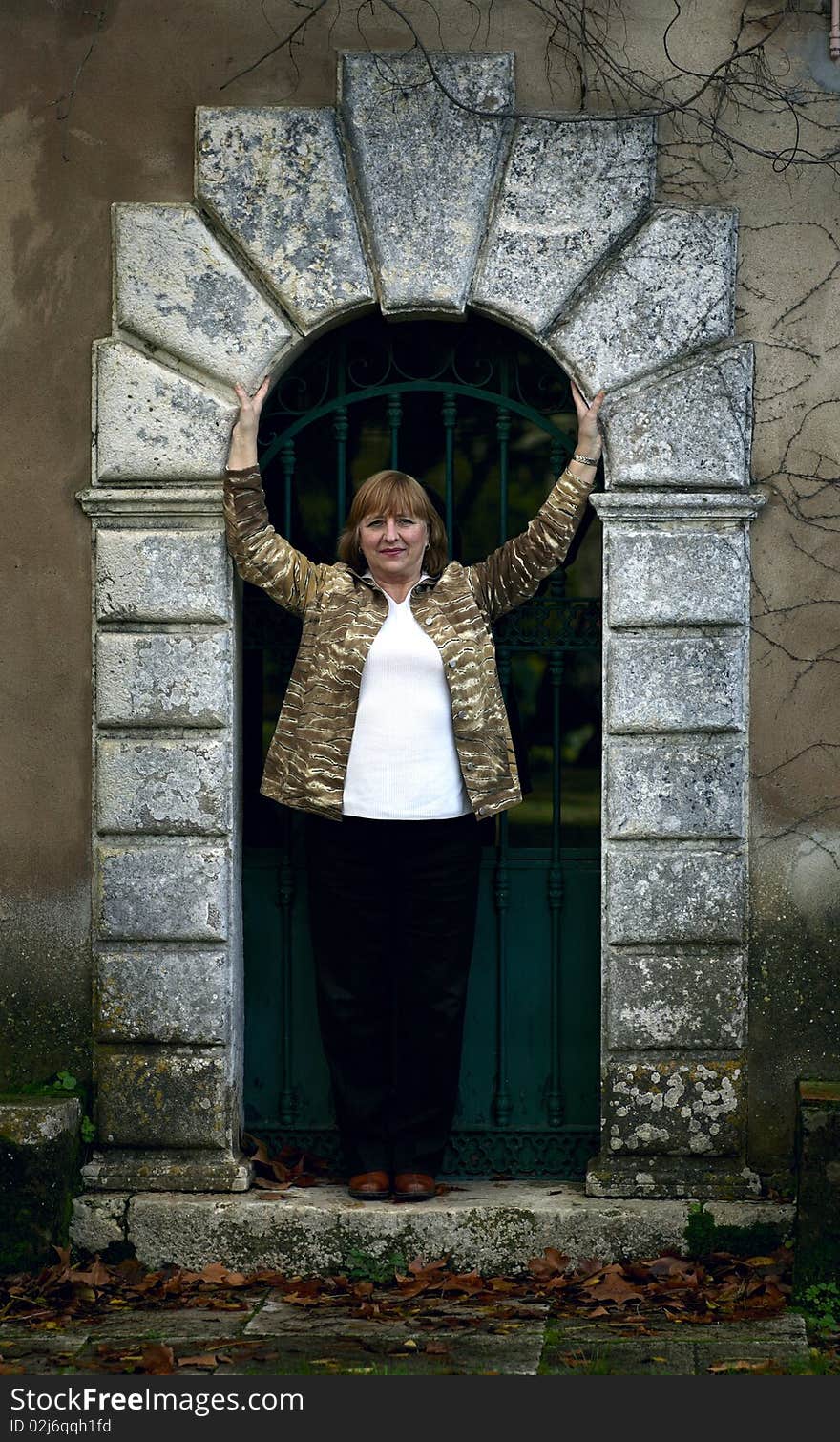 Elegant senior lady portrait on the door