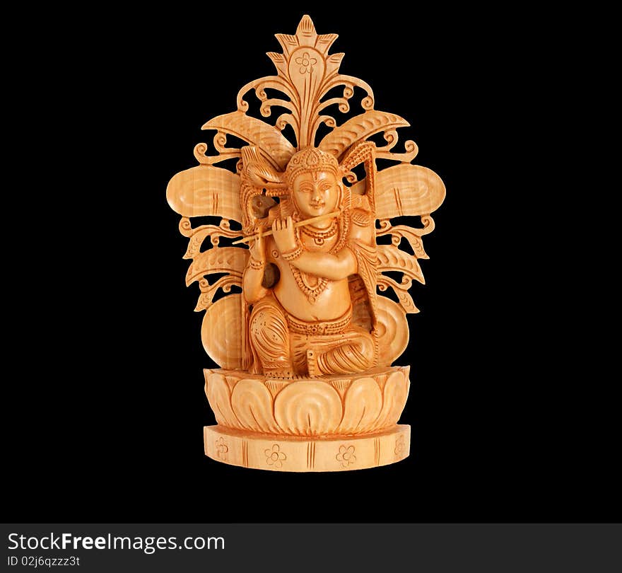 The wooden figure of God, a souvenir gift, India, in isolation. The wooden figure of God, a souvenir gift, India, in isolation