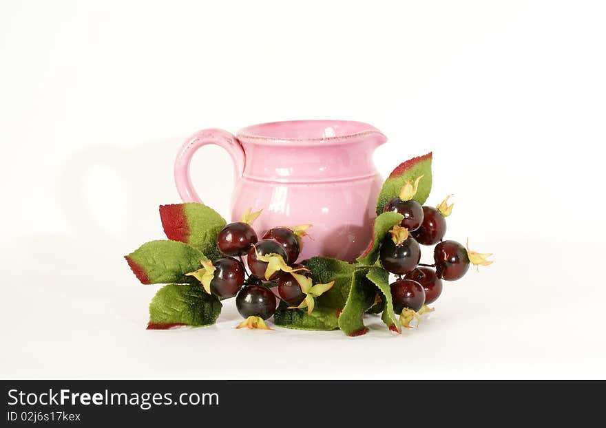 Pink Ceramic Jar With A Sprig Of Souvenir Berries