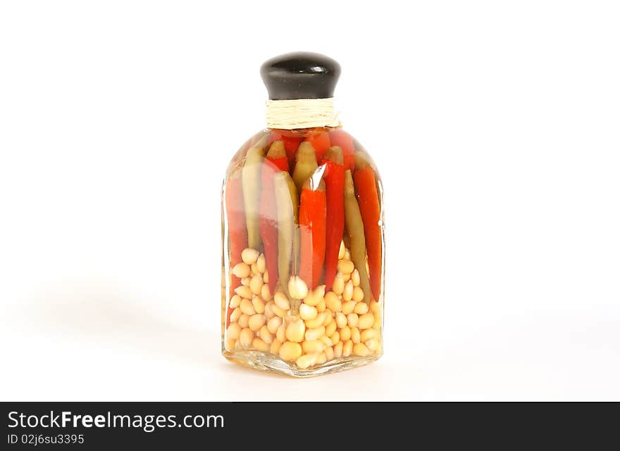 Glass jar of canned red pepper and corn