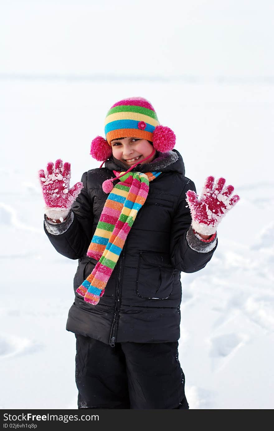 Pretty child on white snow background. Pretty child on white snow background