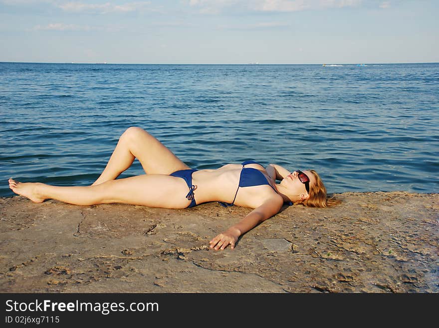 Sexy girl on sea shore