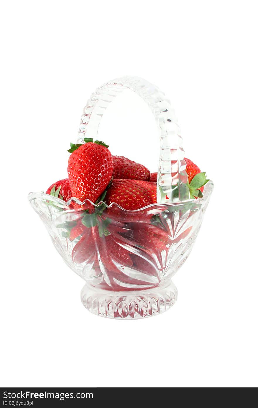 Strawberries in a glass basket isolated on white. Strawberries in a glass basket isolated on white